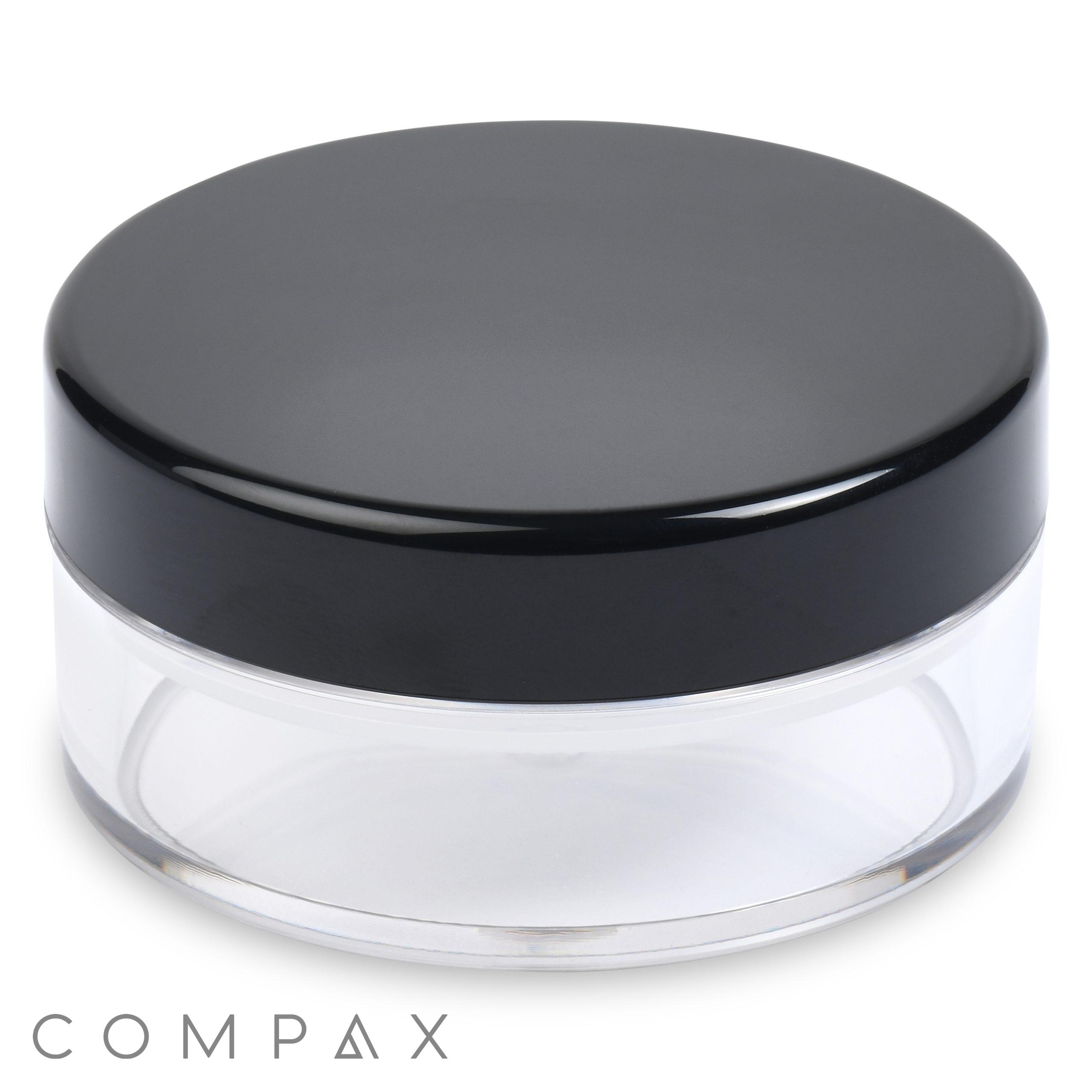 A clear cylindrical container with a black lid, identified as the "20ml Powder Sifter Jar." The container is empty and appears to be designed for holding small items like cosmetics or creams. The brand name "COMPAX" is visible at the bottom of the image.