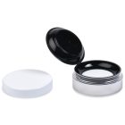 An open 35ml Powder Sifter Jar with a black lid reveals a white makeup sponge inside. Next to it lies a separate, detached white lid. The brand name "COMPAX" is visible at the bottom left of the image.