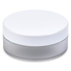 A round, translucent frosted 35ml Powder Sifter Jar with a white lid is centered against a white background. The base of the jar appears semi-transparent with a matte finish. The brand name "COMPAX" is printed in simple gray letters below the jar.