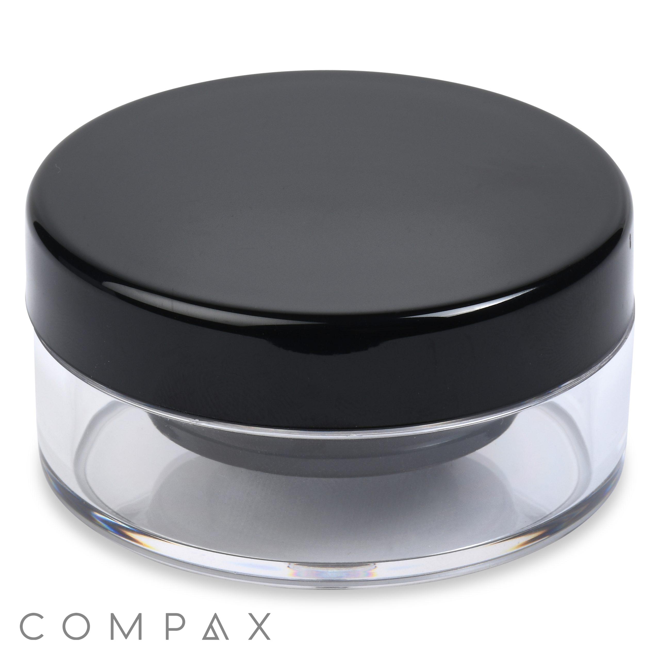 A transparent 16.5ml powder sifter jar with a black screw-on lid. The base of the jar is clear, making the contents visible, and it has "COMPAX" printed below it.
