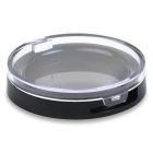 A Round Compact with a clear, transparent lid and a black base, featuring the COMPAK logo in the bottom left corner.