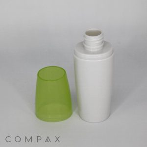 A 60mL Fluted Round PET Bottle with a green, translucent overcap placed next to it. The white, cylindrical plastic bottle is open, with its threaded top visible. The word "COMPAX" is printed at the bottom left corner of the image. The background is plain white.