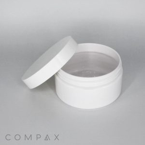 A small, white plastic 250mL PET Jar with a screw-on lid, partially open. The jar is empty and features a minimalistic design. The word "COMPAX" is printed in the lower-left corner against a plain background.
