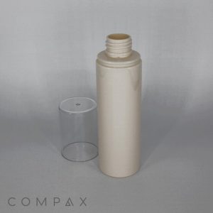 A vertical beige cylindrical 120 mL PET bottle with an open screw-on top, accompanied by a transparent cap placed next to it. The background is gray with a soft gradient. The word "COMPAX" is displayed in the bottom left corner.
