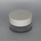 A small, cylindrical 50mL PET jar with a tall cap, featuring a white lid and a clear base. The container appears to be used for cosmetic products. The background is gray, and the word "COMPAX" is subtly printed in the bottom-left corner.