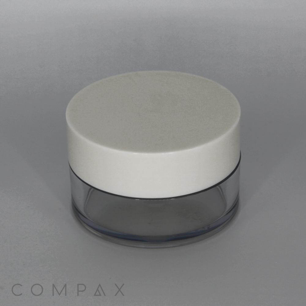 A small, cylindrical 50mL PET jar with a tall cap, featuring a white lid and a clear base. The container appears to be used for cosmetic products. The background is gray, and the word "COMPAX" is subtly printed in the bottom-left corner.