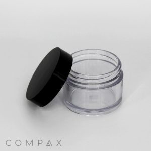 A small, clear, cylindrical 30mL PET Jar with a black screw-on lid, shown open. The background is white, and the image features the "COMPAX" logo in the bottom left corner. The jar appears empty and is made of plastic.