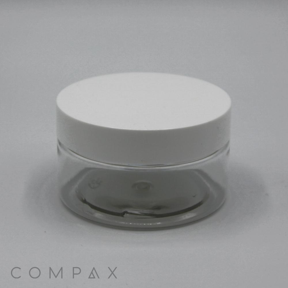 A 120mL PET jar with a white screw-top lid is centered against a light grey background. The word "COMPAX" is written in the bottom left corner of the image. The jar appears to be empty.