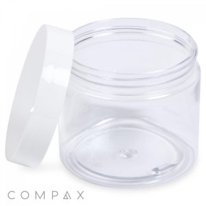 A clear, empty 200mL PET Jar with a wide opening is shown with its white lid resting at an angle on the side. The word "COMPAX" is displayed in gray letters at the bottom left corner of the image.