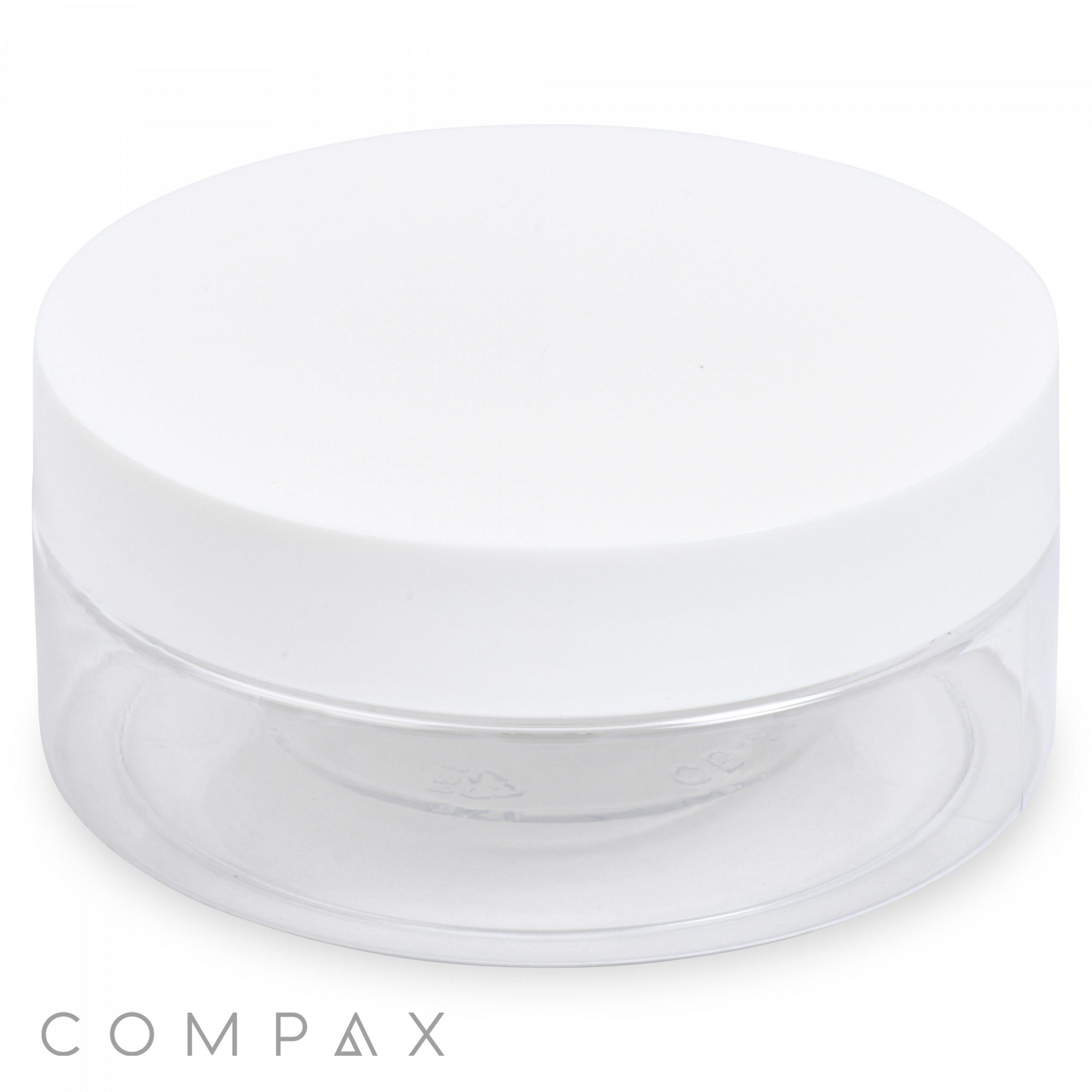 A cylindrical, transparent PET jar with a capacity of 200mL features a wide white lid. The jar allows clear visibility of its contents when filled. The brand name "COMPAX" is inscribed in small grey letters at the bottom left corner of the image.