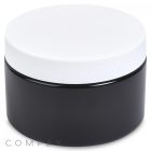 A 300mL PET Jar, round and black with a white screw-on lid, is displayed against a white background. It seems to be made of plastic and features the label "COMPAX" in light gray text at the bottom left.
