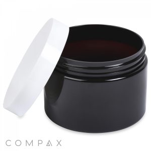 A black, cylindrical 350mL PET jar with a white lid, which is partially opened and resting on the side. The brand name "COMPAX" is displayed in the bottom left corner of the image. The container appears to be suitable for storing cosmetics or other small items.