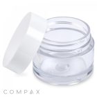 A transparent 15mL PET jar, open and empty, with a matching white lid tilted to the side. The clean jar has no visible labeling and features "COMPAX" printed at the bottom left corner of the image.