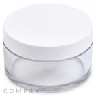 A small, transparent, round 30mL PET jar with a flat, white screw-on lid. The jar is empty and made of clear plastic, displaying the logo "COMPAX" at the bottom of the image.