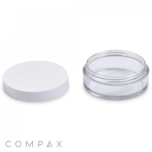 A clear, round PET jar with a capacity of 20mL and a white lid. The lid is displayed separately on the left side of the image, while the open jar is on the right. The word "COMPAX" appears in small text at the bottom left corner of the image.