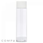 A transparent 100 mL PET Bottle with a white cap stands upright on a white background. The word "COMPAX" is written in gray lowercase letters at the bottom left corner of the image.