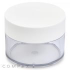 A 150mL PET Jar, featuring a clear cylindrical plastic body with a white lid. The bottom half of the jar is transparent, while the top half is opaque white. The brand name "COMPAX" is subtly printed on the bottom left corner of the image.