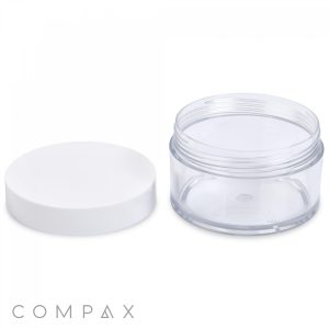 A transparent, empty 200mL PET jar with a white lid beside it. The brand name "COMPAX" is displayed at the bottom left corner of the image. The jar and lid are placed against a plain white background.