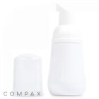 A 50 mL PET Foamer Bottle with a white pump top and a separate transparent cap placed next to it. The word "COMPAX" is written in small letters at the bottom left corner of the image.