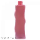 A tall, translucent pink 250 mL PET Bottle features a wavy design and a narrow, open neck. The word "COMPAX" is displayed in gray font in the bottom-left corner. The bottle stands upright against a white background.