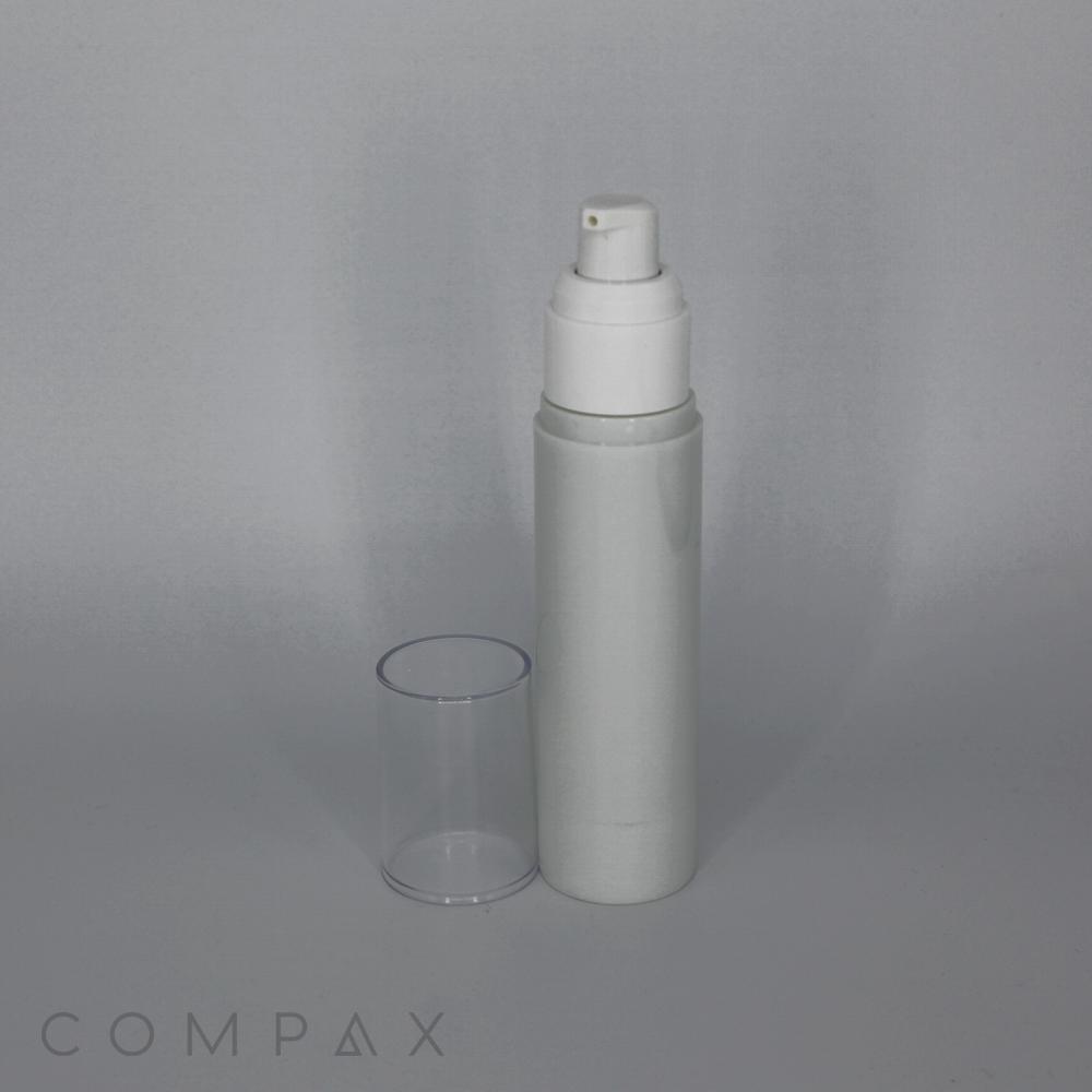 A white and gray Round Acrylic Airless Bottle with a removable clear cap stands against a plain gray background. The branding "COMPAX" is faintly visible at the bottom left corner of the image.