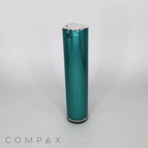 A sleek, cylindrical teal bottle labeled "Round Airless Bottle" stands upright against a plain white background. The bottle showcases a silver top and a small, discreet button near the top. The brand name "COMPAX" is displayed in gray letters at the bottom left corner of the image.