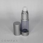 A sleek, silver Round Airless Bottle with its cap placed beside it. The bottle is partially transparent, revealing the inner chamber. The brand name, "COMPAX," is subtly displayed at the bottom left of the image.