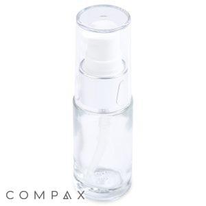 A 15mL Glass Cylinder Round Bottle featuring a clear glass body, a white dispenser, and a transparent cap. The bottle is empty and stands upright with the word "COMPAX" written in gray capital letters at the bottom left of the image. The background is plain white.