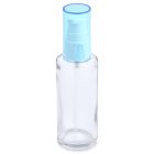 A 50mL glass cylinder round bottle with a transparent body, a light blue pump, and a clear cap, designed for dispensing liquids. The word "Compax" is written in gray text at the bottom left corner. The bottle is empty and stands upright against a plain white background.
