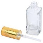 A 30mL Glass Square Bottle with an open top lies next to a detached gold spray nozzle on a white surface. The nozzle is positioned horizontally, revealing the dip tube extending from it. The brand name "COMPAX" is displayed in the bottom left corner.