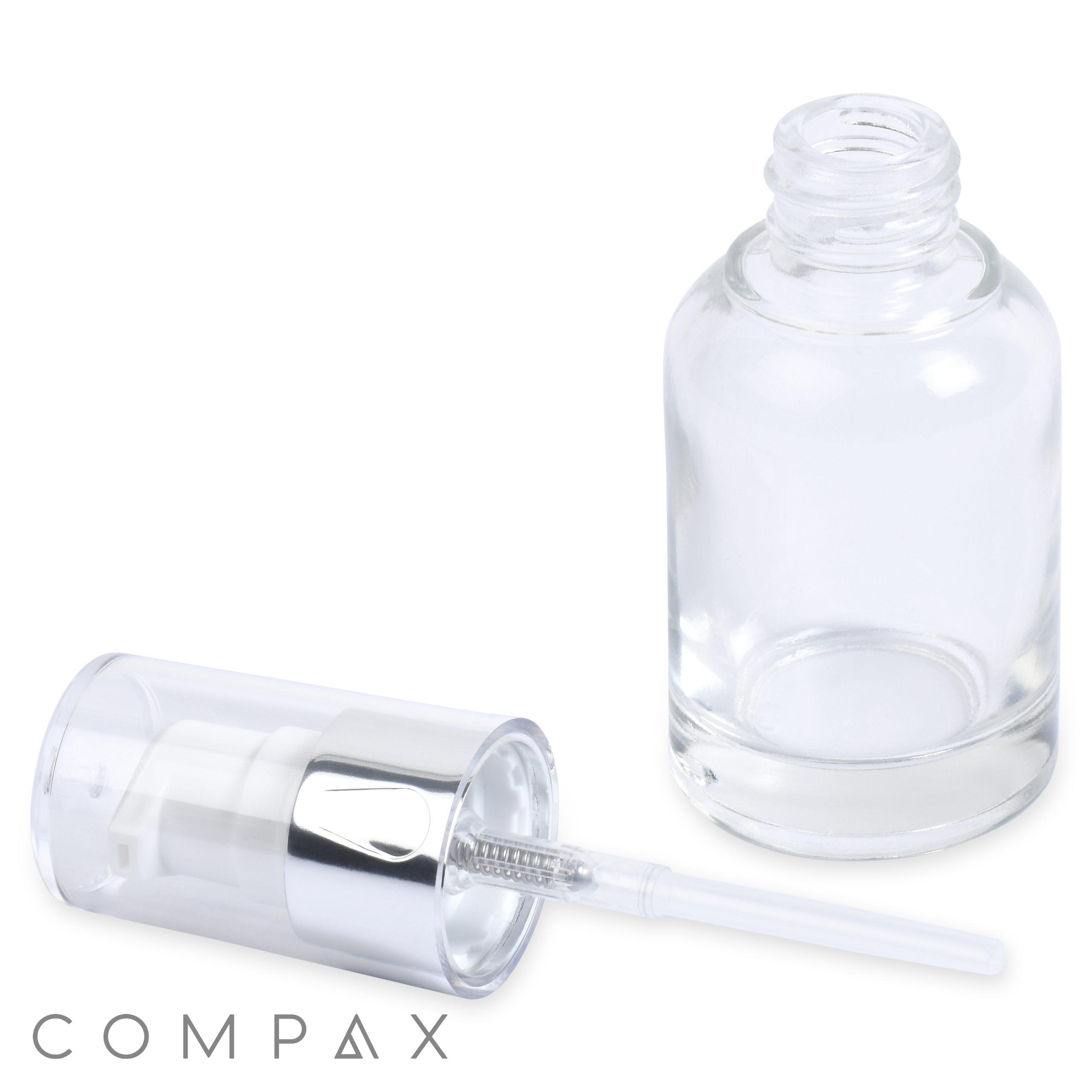 A small, clear glass bottle, the "30mL Glass Cylinder Round Bottle," features a cylindrical shape and a metallic cap with an integrated applicator wand. The cap is positioned beside the open bottle, with the wand resting on the surface. The brand name "COMPAX" is displayed at the bottom.