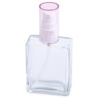 A clear 60mL glass oblong spray bottle featuring a white spray nozzle and a transparent pink cap. The bottle is empty, with the brand name "COMPAX" displayed at the bottom left corner.