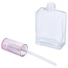 A clear rectangular 60mL glass oblong bottle featuring an attached spray nozzle and a detached pink cap positioned next to it. The nozzle tube extends inside the bottle, and the word "COMPAX" is displayed at the bottom left of the image.