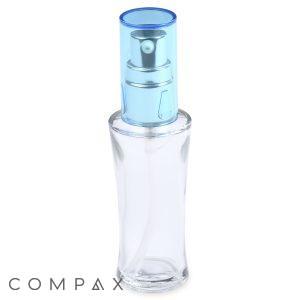 The 30mL Glass Fluted Bottle is a transparent spray bottle with a blue cap, featuring a silver pump mechanism. It boasts a sleek, curved design and is currently empty. The word "COMPAX" is displayed in gray lettering at the bottom left corner of the image.