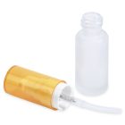 A 15mL Glass Cylinder Round Bottle with its white cap removed, lying on its side next to the bottle. The cap has an attached clear tube. The bottle has a frosted or opaque finish, and the cap is partially transparent with a yellow tint. The word "COMPAX" is printed below.