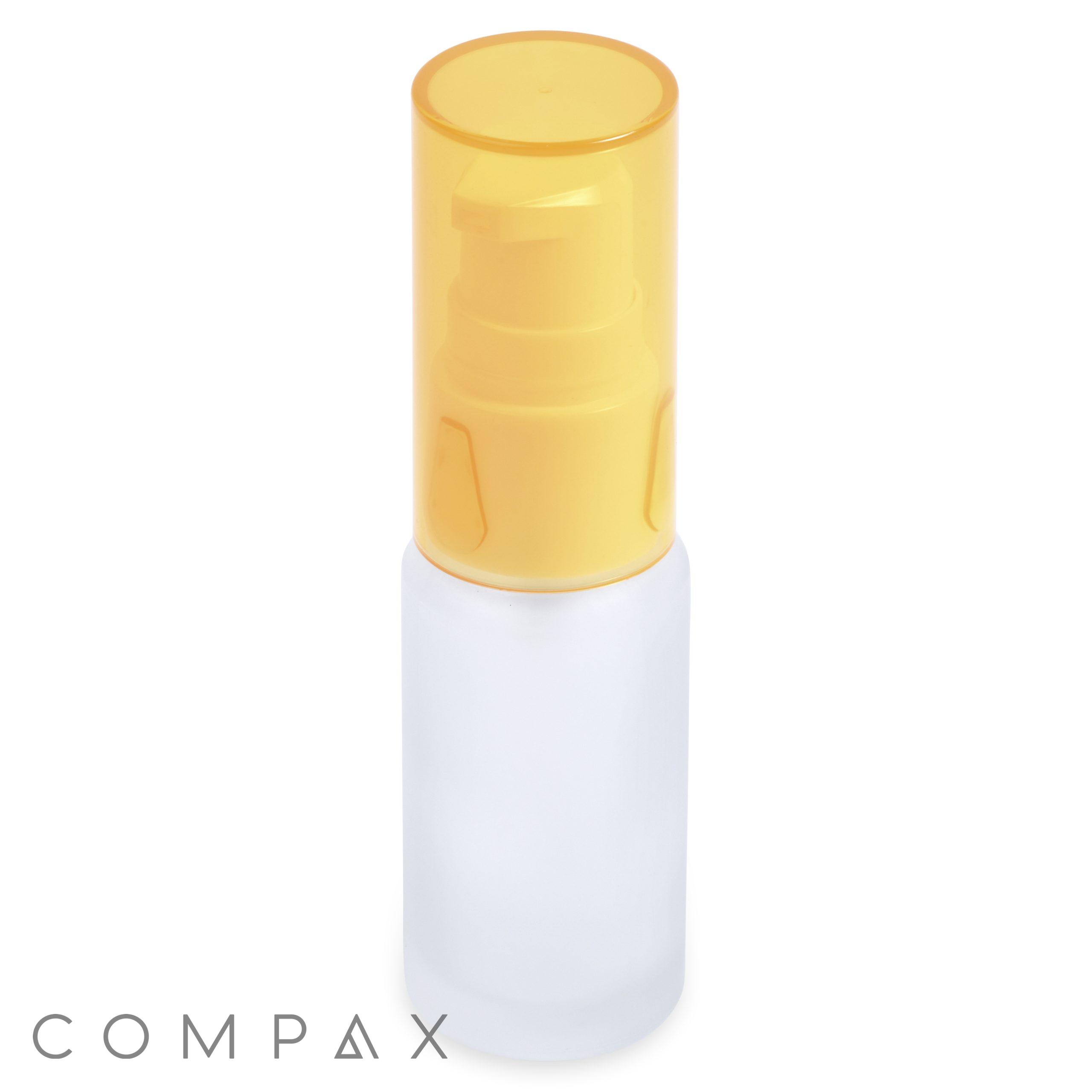 A 15mL glass cylinder round bottle with a yellow pump top. The word "COMPAX" is visible at the bottom left corner of the image.