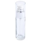 A 30mL Glass Cylinder Round Bottle with a transparent build, clear cap, and silver pump. The bottle is empty and features the word "COMPAX" in gray letters at the bottom left corner.