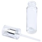 A clear, empty 30mL Glass Cylinder Round Bottle stands upright next to a detached, matching clear plastic screw cap with a silver band. A small dip tube extends from the inside of the cap. The brand name "COMPAX" is visible in the lower-left corner.