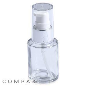 A 30mL Glass Cylinder Round Bottle with a white pump dispenser and a transparent cap stands empty and upright against a white background. The word "COMPAX" is visible in the bottom left corner of the image.