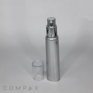 A sleek, silver 25mm Airless Pump Tube with a clear, detachable cap stands upright against a plain, light gray background. The tube has a polished finish, and the brand name "COMPAX" is visible at the bottom of the image.