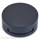 An Airtight Eyeshadow Compact in a round, black compact case with a sleek design sits closed against a white background. The case appears to be made of glossy material. The word "COMPAX" is displayed in light gray letters at the bottom left corner of the image.