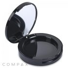 The Round Single Pan Blush Compact is a round, black case with an open lid and a mirror inside. The compact features a glossy finish and the brand name "COMPAX" is clearly visible in the bottom left corner of the image.
