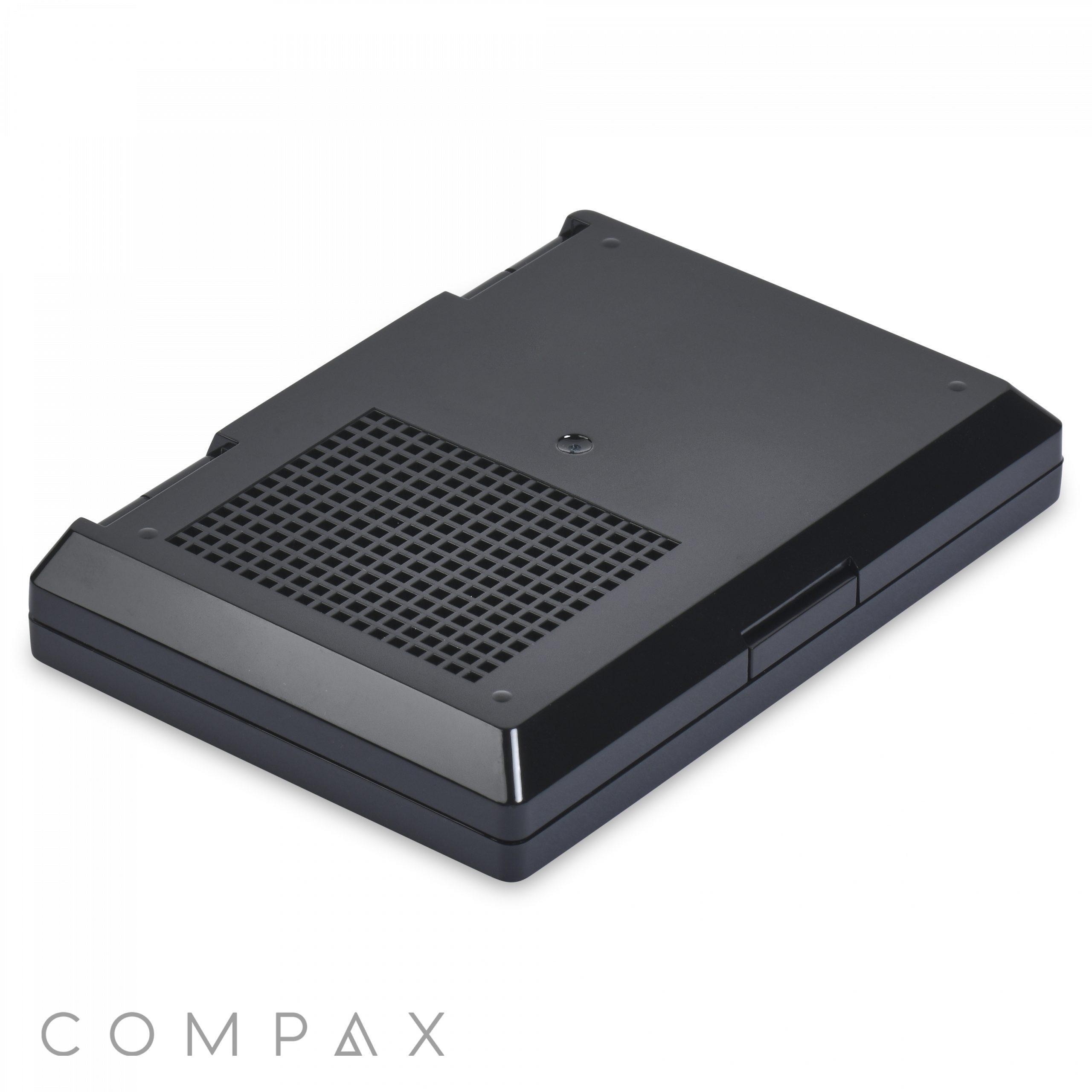A black Square Double Pan Compact external hard drive with a vented section for cooling, seen from a slightly angled top perspective. The device features the brand name "COMPAX" in the bottom left corner of the image.