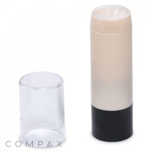 A cylindrical container with a black base and a clear cap, featuring a white product inside, identified as "Round Lipstick." The cap is placed beside the container on the left. The word "COMPAX" is visible in the bottom left corner.