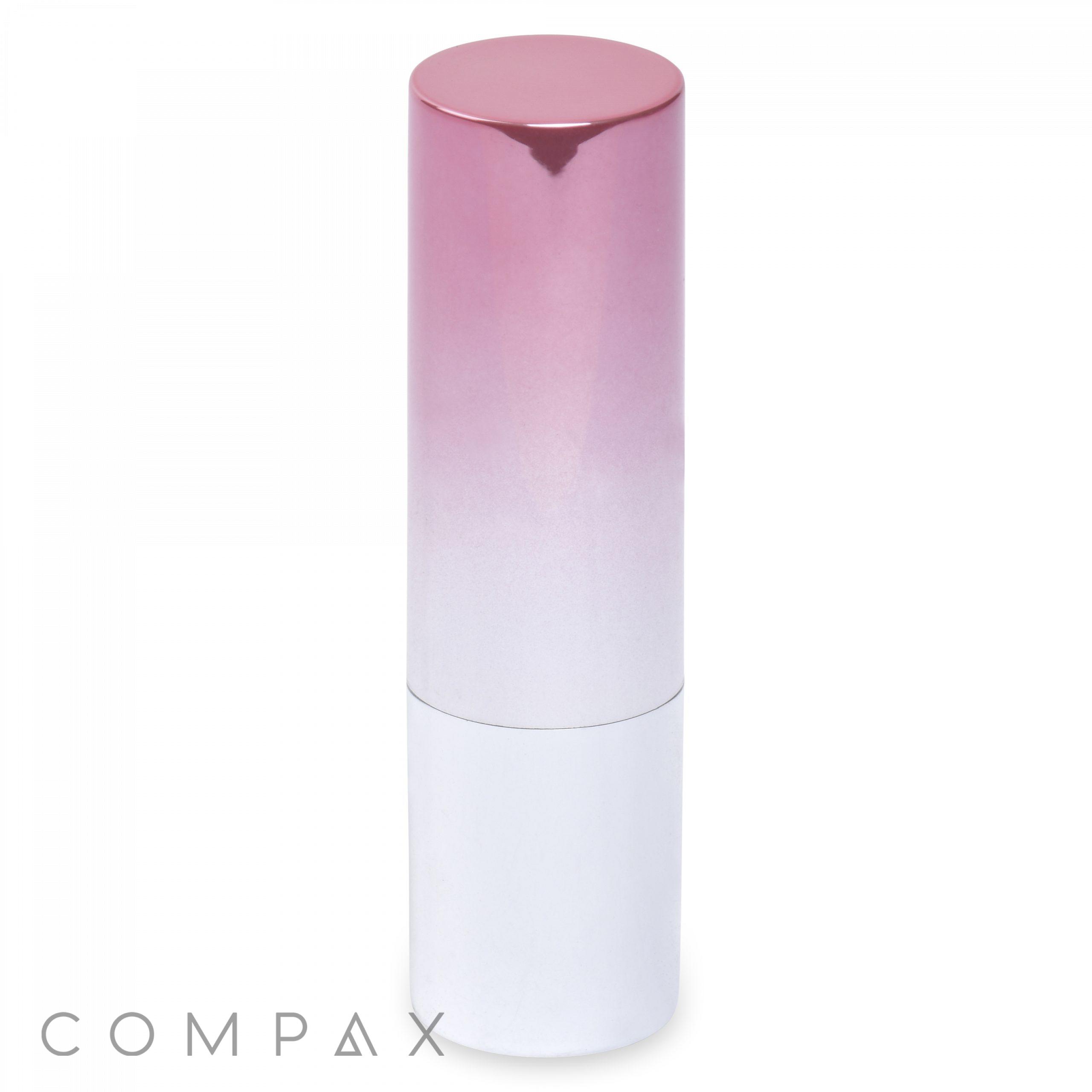 A cylindrical Round Lipstick tube features a gradient design shifting from pink at the top to white at the bottom. The lid, predominantly pink in color, covers more than half of the tube. The brand name "COMPAX" is displayed in grey letters at the bottom left corner.