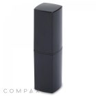 A modern, black, square lipstick tube with a sleek design. The cap seamlessly fits onto the base, creating a uniform appearance. The image features the word "COMPAX" in the bottom left corner.