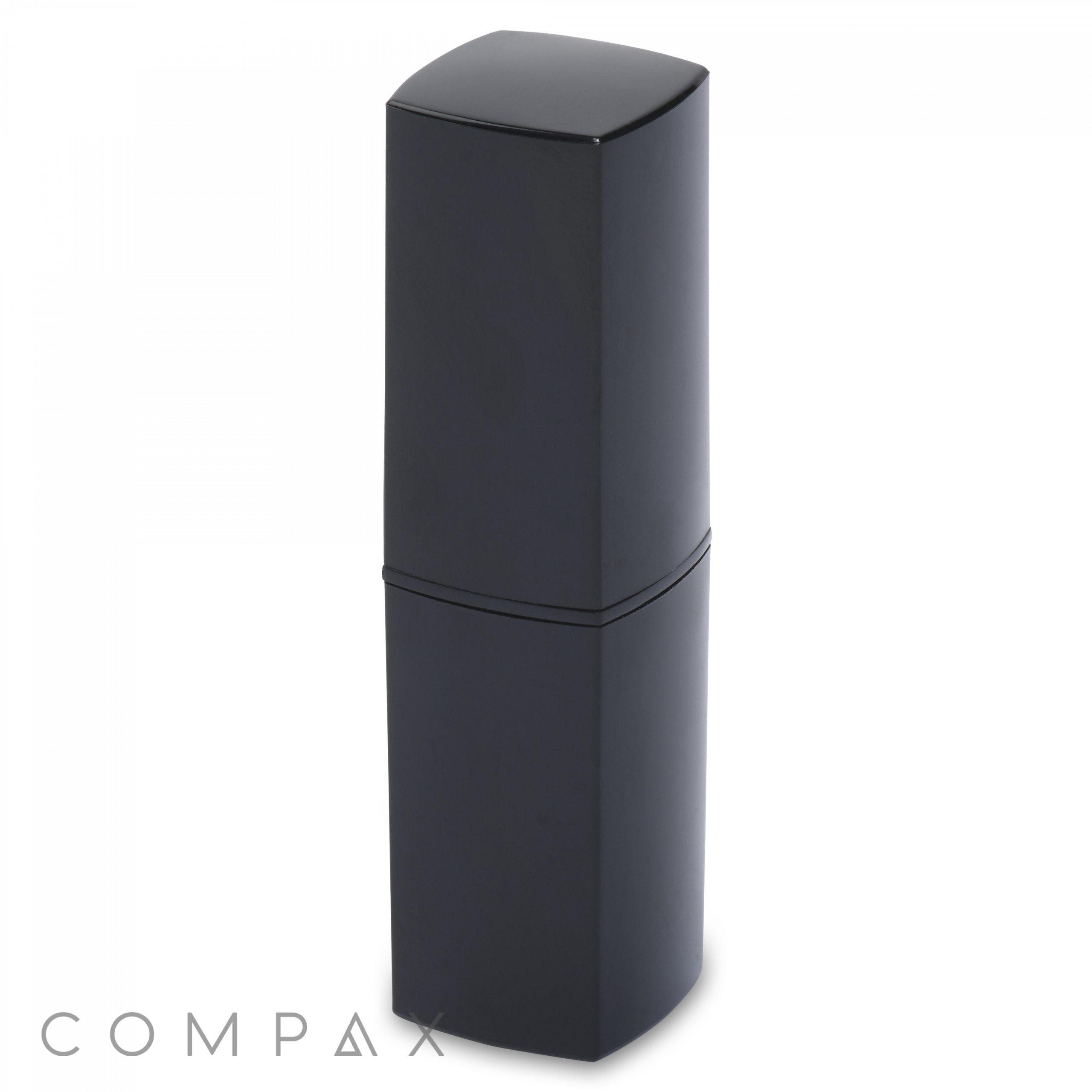 A modern, black, square lipstick tube with a sleek design. The cap seamlessly fits onto the base, creating a uniform appearance. The image features the word "COMPAX" in the bottom left corner.