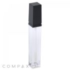 The Square Lip Gloss features a slim, rectangular, clear plastic bottle topped with a black square cap. Designed for cosmetic products, it elegantly displays the brand name "COMPAX" in gray lettering at the base. The overall design is minimalist and sleek.