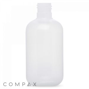 A translucent, empty 4oz Boston Round Bottle with a rounded rectangular shape stands upright against a white background. The bottle has a threaded neck, designed for a screw-on cap. The Compax logo is visible in the bottom left corner.