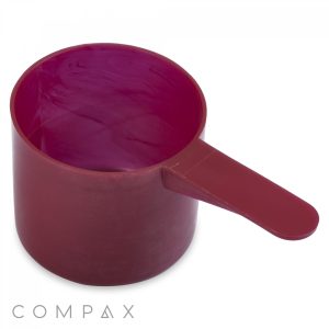 A 60cc Scoop with a long handle. The inside is maroon with some lighter swirled patterns. The brand name "COMPAX" is visible at the bottom left corner of the image.